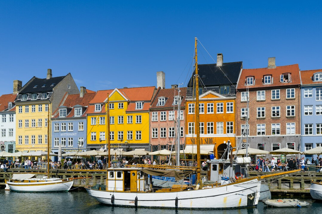 Danish fisherman standing on a harbor pier at dawn