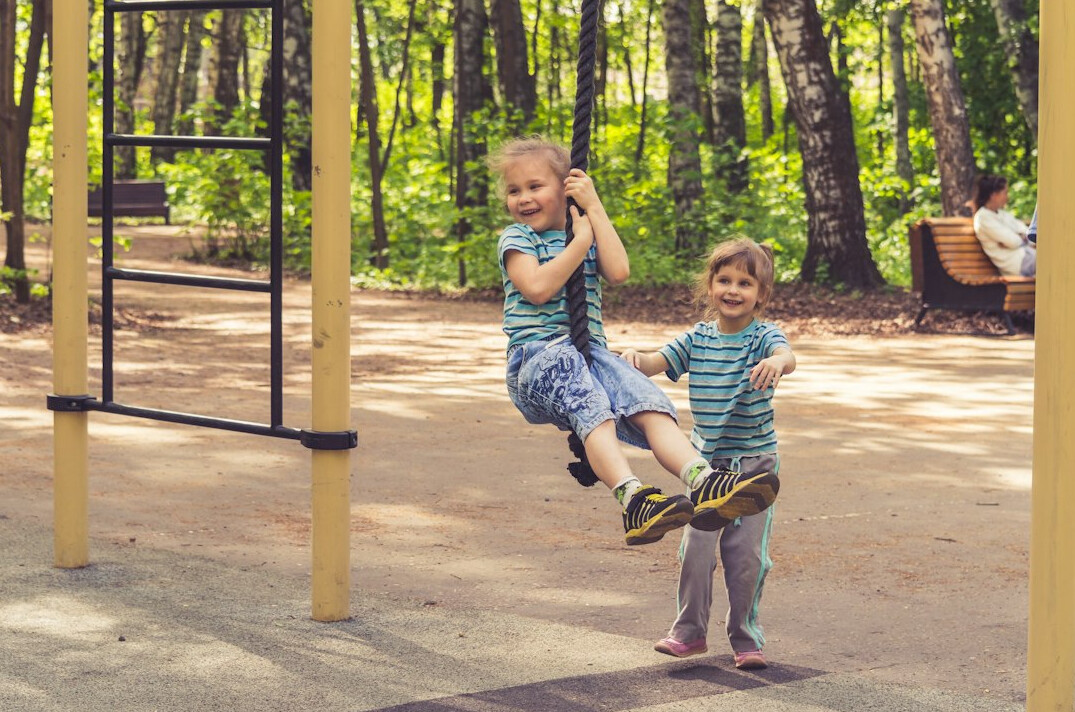 Children playing on a residential street in a Danish neighborhood